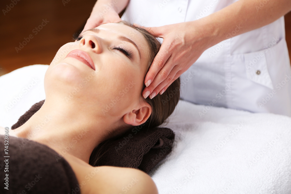 Beautiful young woman having massage in spa salon Beautiful young woman having massage in spa salon