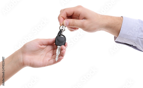 Businessman holding car key isolated on white