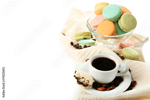 Gentle colorful macaroons in glass bowl and black coffee in mug