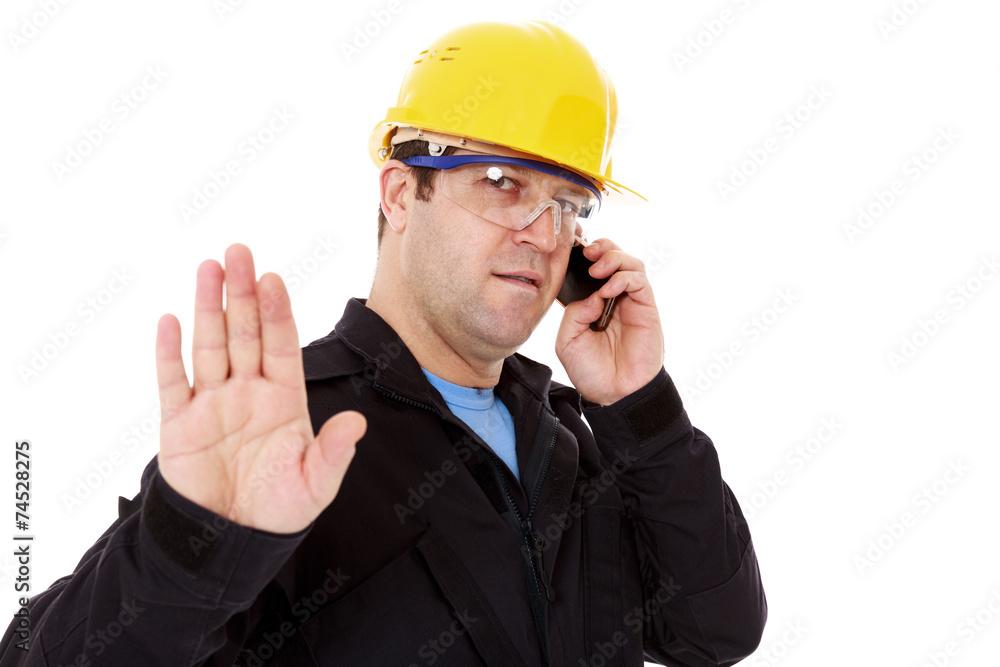 engineer talking on the phone and make the stop sign with hand engineer talking on the phone and make the stop sign with hand