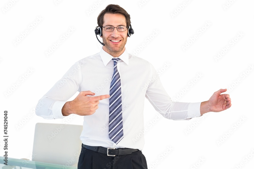 Businessman using a headset while presenting with hands Businessman using a headset while presenting with hands