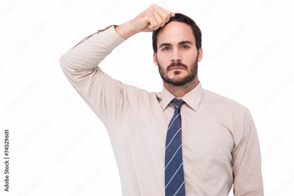 Serious businessman standing with hand on head Serious businessman standing with hand on head