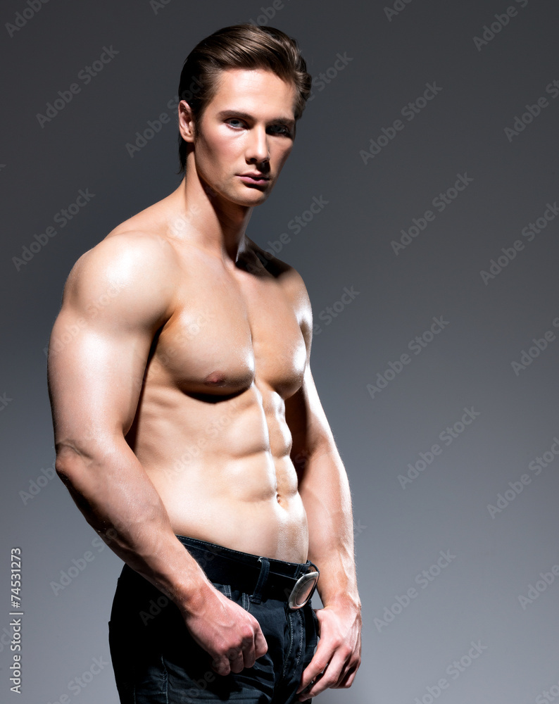 Handsome man with sexy muscular beautiful body. Stock Photo | Adobe Stock