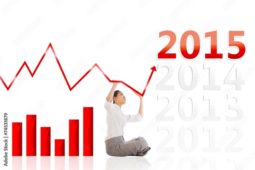Composite image of businesswoman sitting cross legged pushing up Composite image of businesswoman sitting cross legged pushing up
