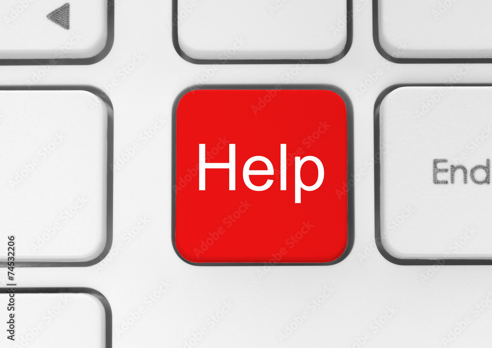 Red help button on the keyboard close-up. Red help button on the keyboard close-up.