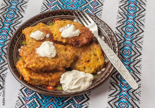 Traditional Ukrainian homemade potato pancakes (draniks) photo