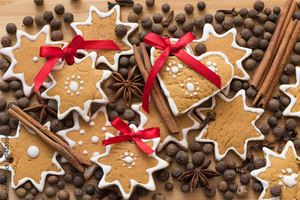 Gingerbread and spice scattered on a wooden table Gingerbread and spice scattered on a wooden table