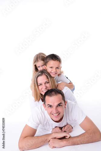 isolated studio shot happy family of four with little kids