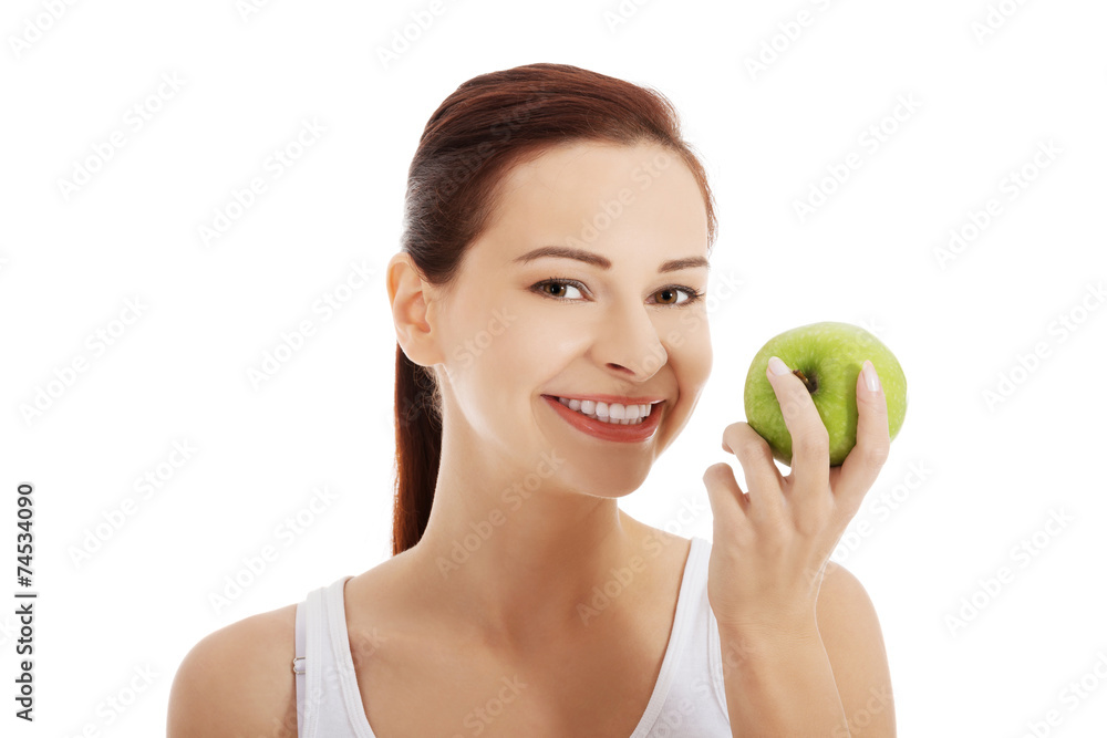 Portrait of brunette woman holding an apple Portrait of brunette woman holding an apple