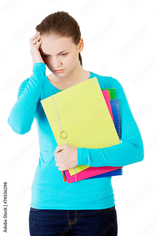 Young worried student holding her notes Young worried student holding her notes