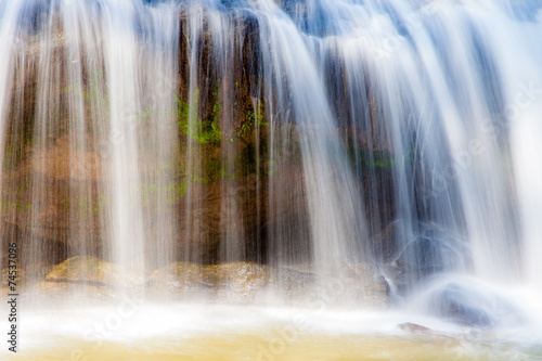 Close-up scenic waterfall flowing on stone at Mae Sa waterfall D © PPstock