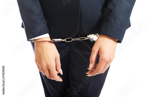 Close up on businesswoman with handcuffs