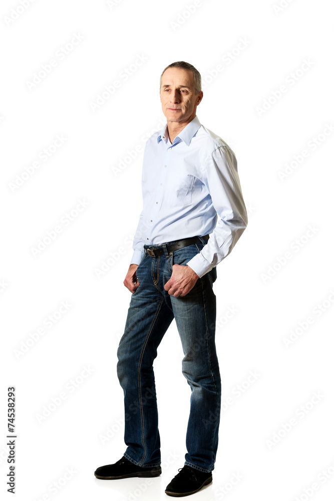 Full length of handsome man with hands in pockets Full length of handsome man with hands in pockets