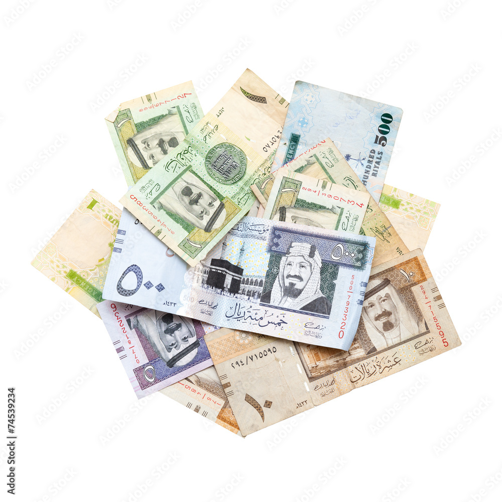 Pile of modern Saudi Arabia money isolated on white Pile of modern Saudi Arabia money isolated on white
