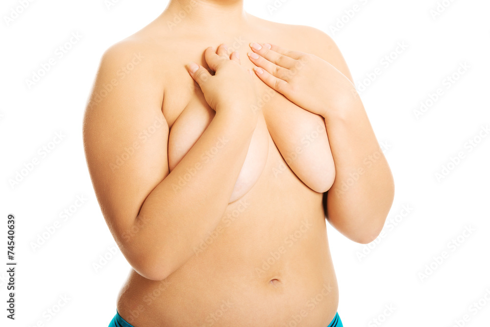 Fototapeta premium Overweight woman covering her breast