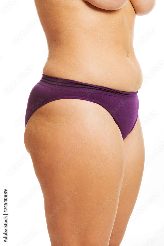 Foto de Woman's fat belly in underwear do Stock