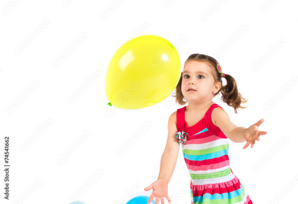 Kid playing with balloons over white background Kid playing with balloons over white background