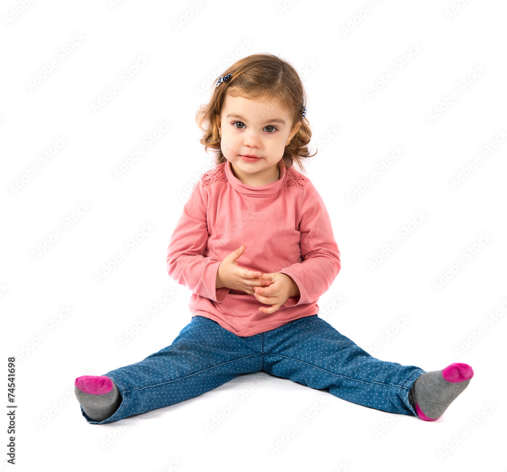Cute girl sitting over white background Cute girl sitting over white background