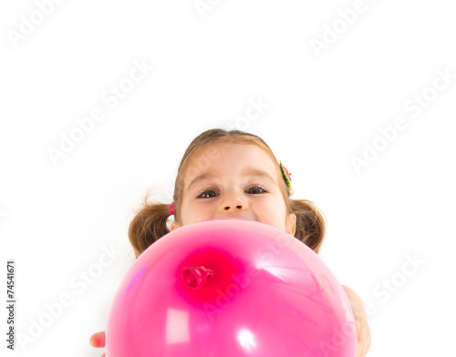 Kid playing with balloons over white background