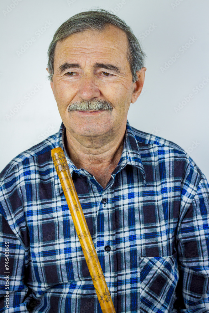 Fototapeta premium Man playing on pipe flute