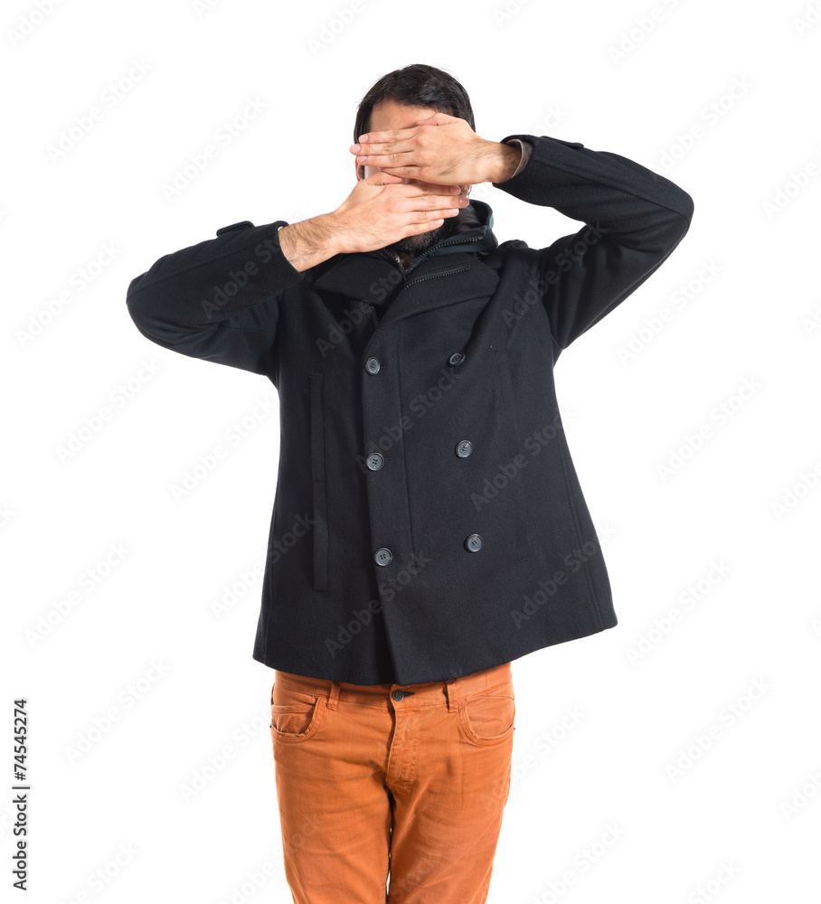 Man covering his face Man covering his face