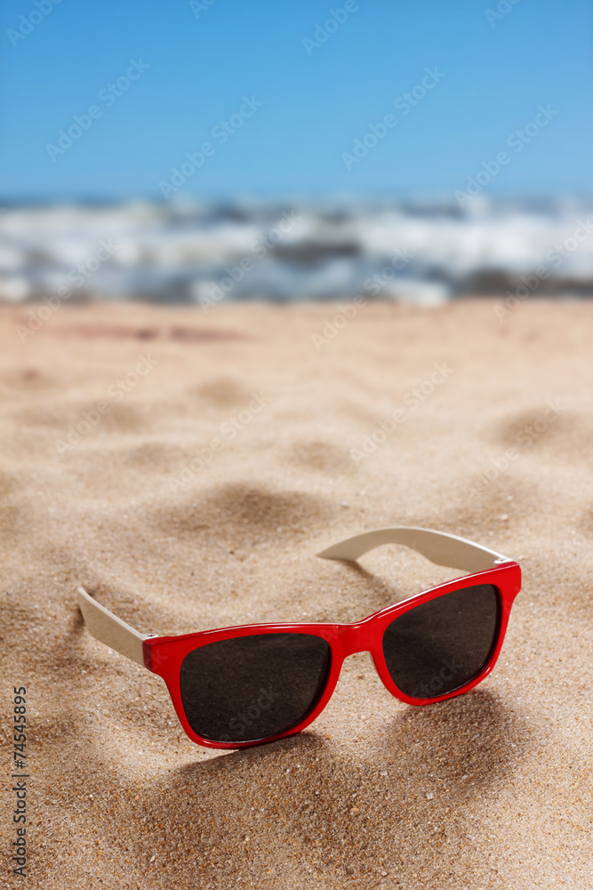 Sunglasses on a sandy beach