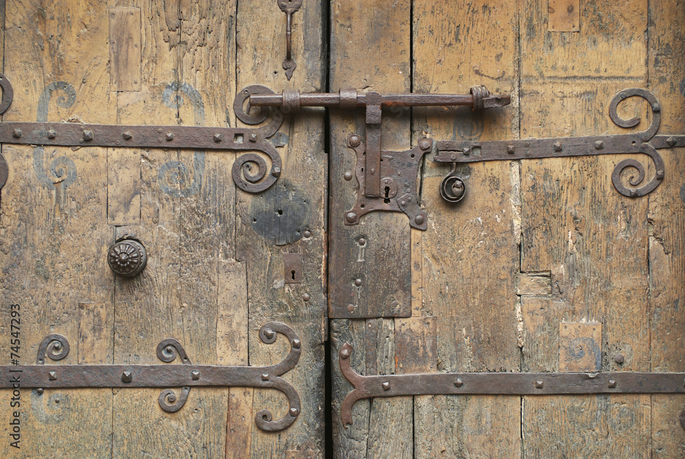 Old wooden gate, Villefranche de Conflent, France. Old wooden gate, Villefranche de Conflent, France.