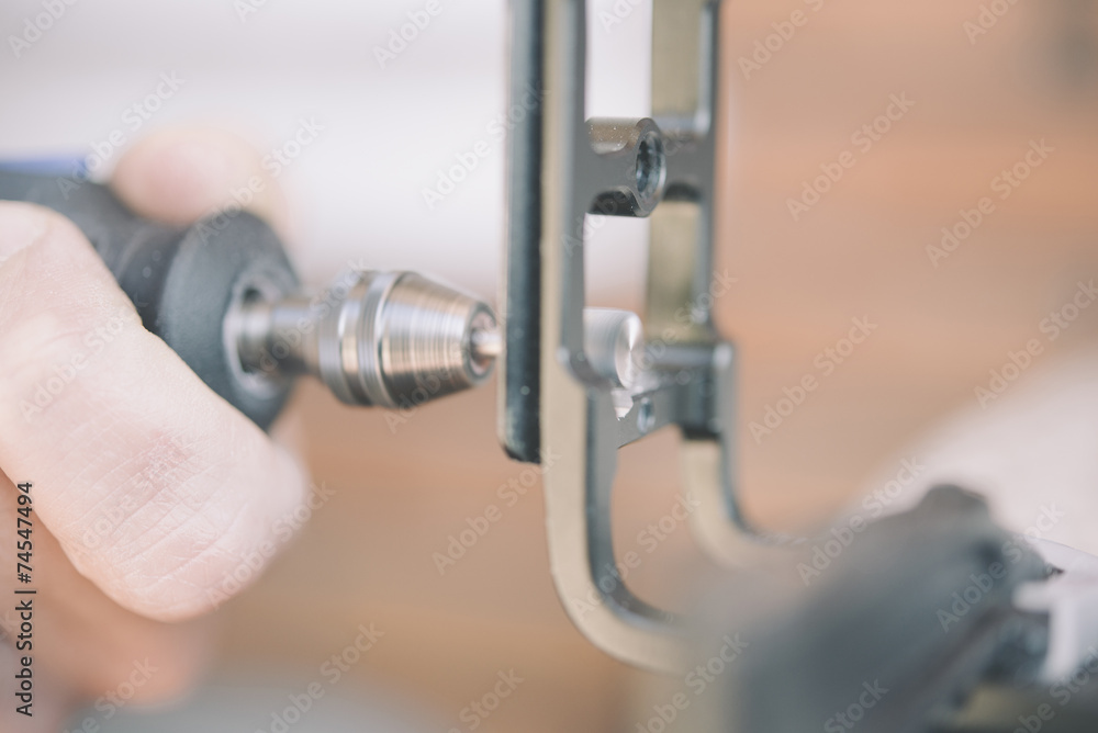 using a rotary tool to cut a new slot in a wood screw