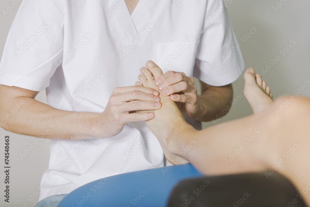Obraz premium Beautiful young woman relaxing with hand massage at beauty spa