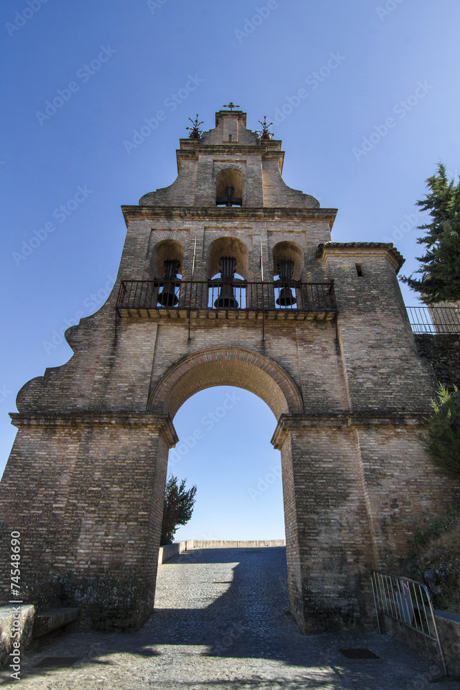 arc bell tower entrance located in Aracena, Spain.