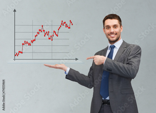 happy man showing forex chart on palm of his hand