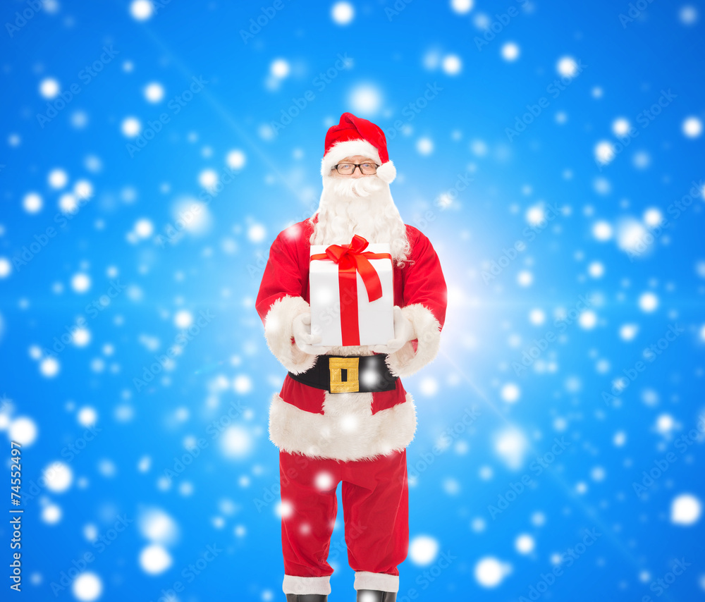 man in costume of santa claus with gift box man in costume of santa claus with gift box