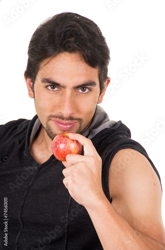 handsome young man holding red apple