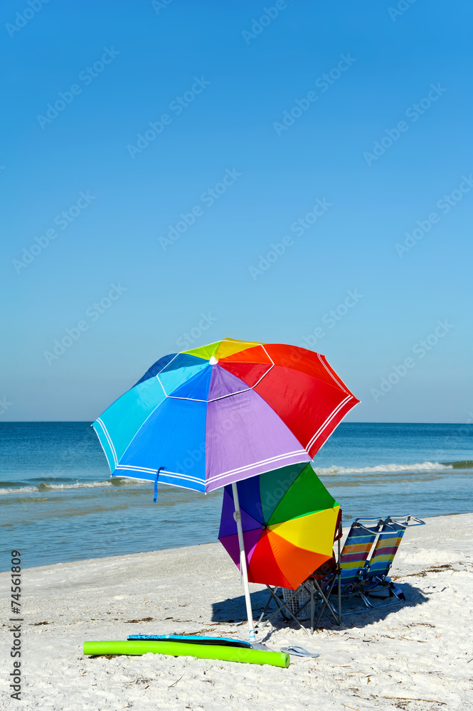 Beach Chairs with Bright Color Umbrellas