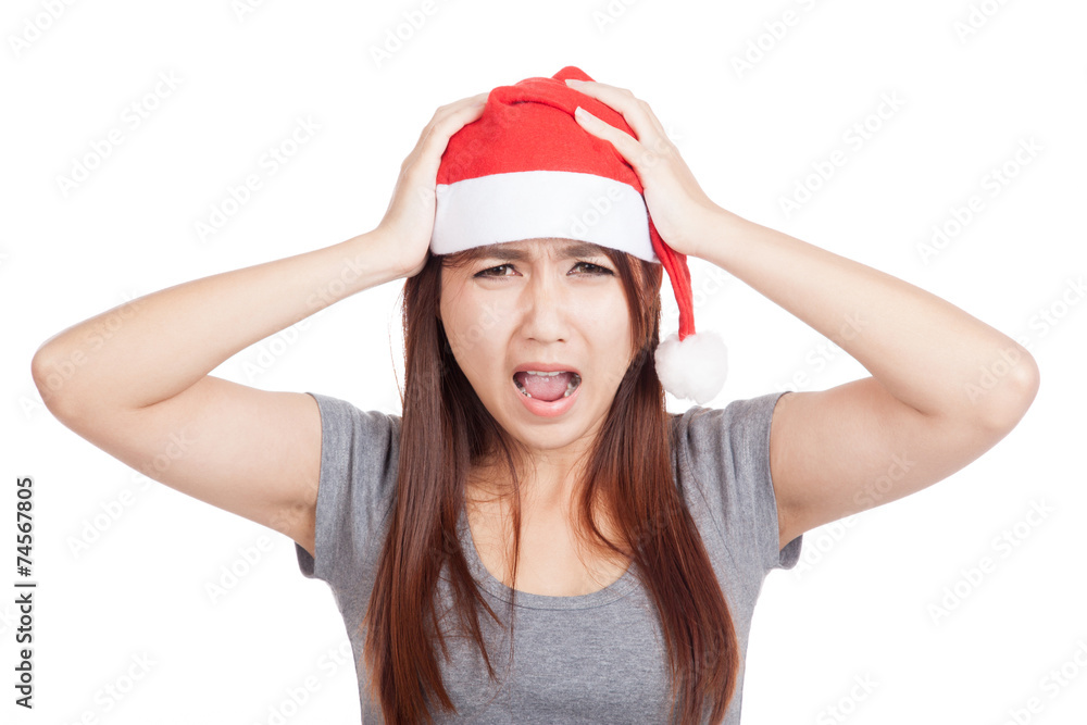 Frustrated Asian girl with red santa hat Frustrated Asian girl with red santa hat