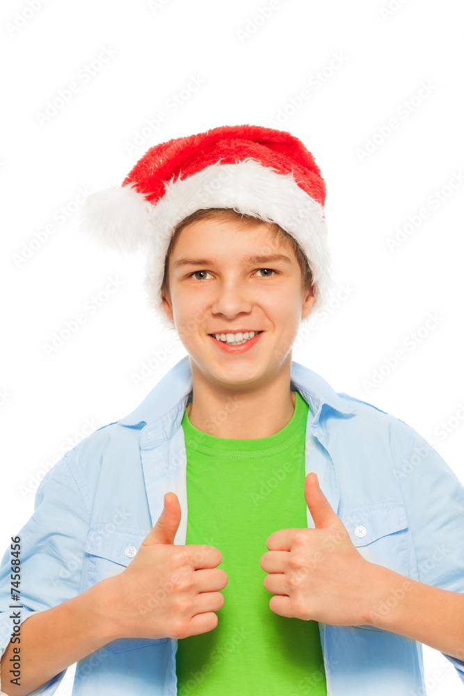 Boy in Santa hat holding thumbs up Boy in Santa hat holding thumbs up