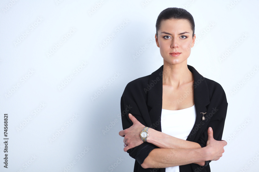 Young woman standing, isolated on gray background Young woman standing, isolated on gray background