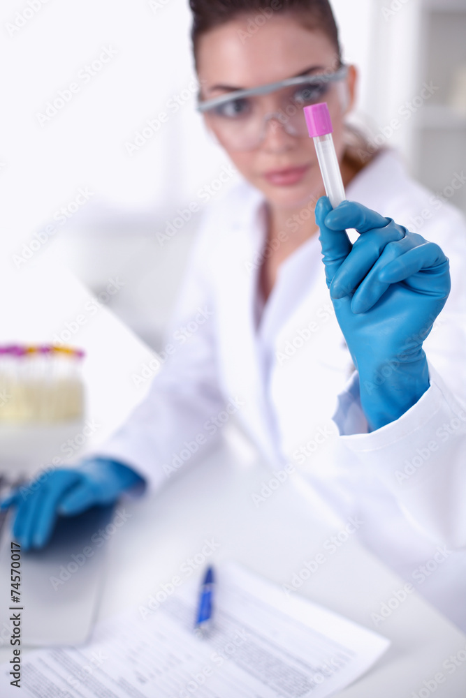 Woman researcher is surrounded by medical vials and flasks, Woman researcher is surrounded by medical vials and flasks,