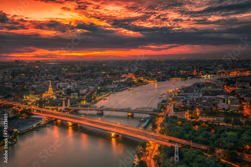 Photography River, wat, temple, pagoda and vintage bridge with sunset sky