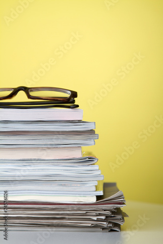 Stack of newspapers and magazines photo