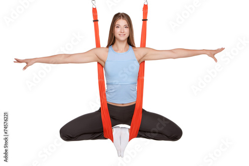 Young woman doing  aerial yoga photo