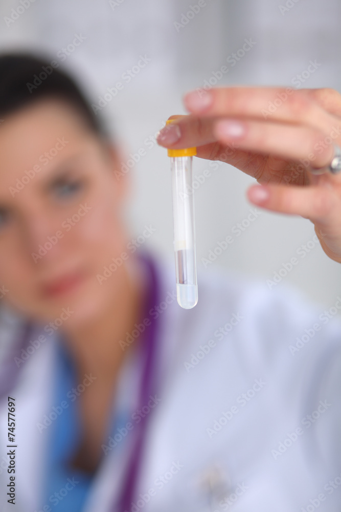 Woman researcher is surrounded by medical vials and flasks, Woman researcher is surrounded by medical vials and flasks,