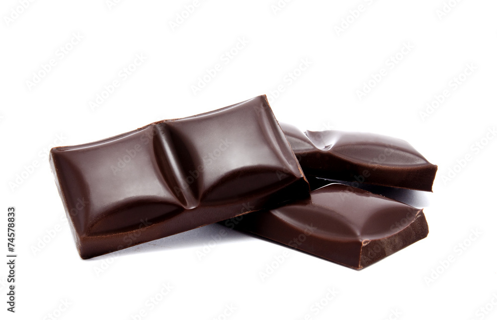 Dark chocolate bars stack with crumbs isolated Dark chocolate bars stack with crumbs isolated