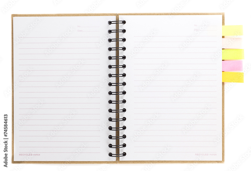Spiral notebook open on white with colorful note paper Spiral notebook open on white with colorful note paper