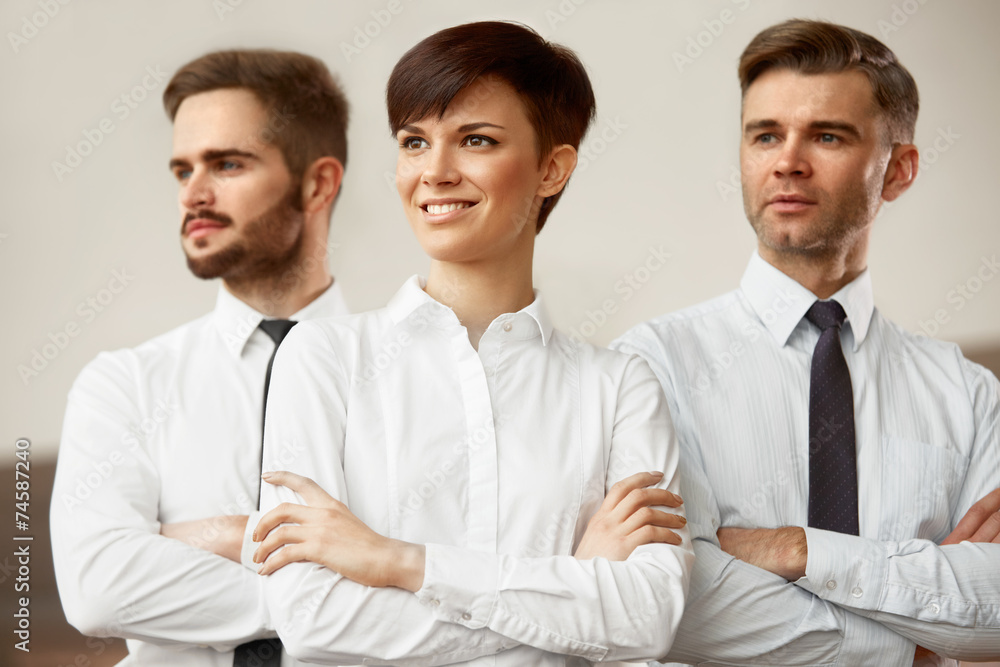 Business Team. Happy smiling people standing in office Business Team. Happy smiling people standing in office