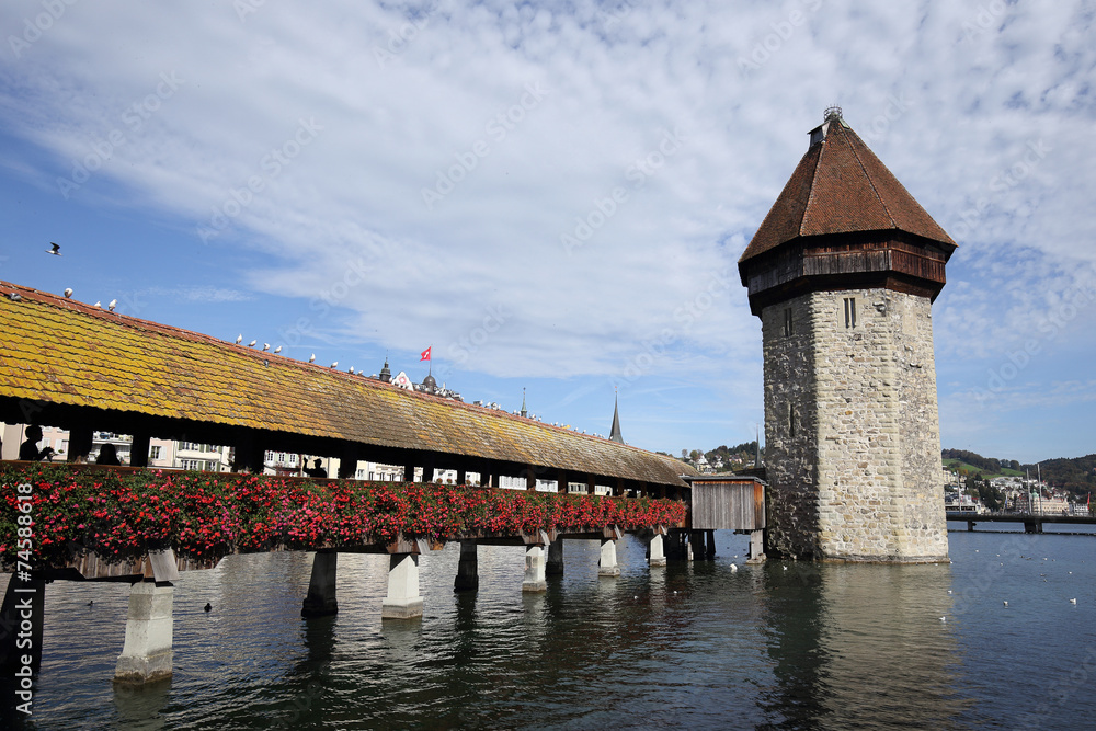 View on the old wooden chapel bridge in Lucerne Switzerland .