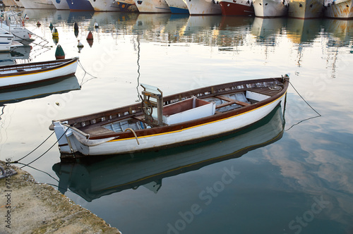 Wooden boat vintage type on offshore berth photo