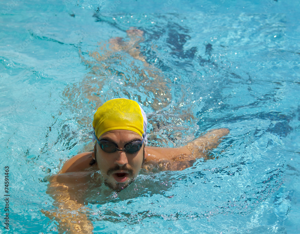 portrait swimmer beautiful boy swims in pool crawl
