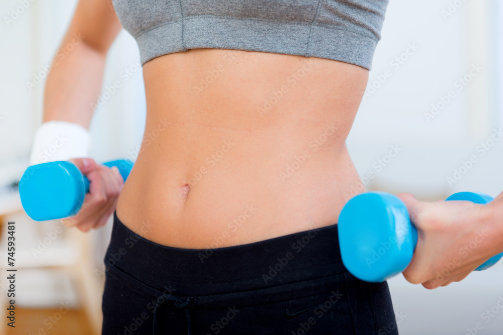 Close up on the back of a woman doing sport Close up on the back of a woman doing sport