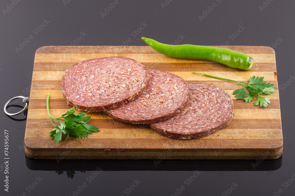 Raw Turkish Ottoman Sausage on the Wooden Board Raw Turkish Ottoman Sausage on the Wooden Board